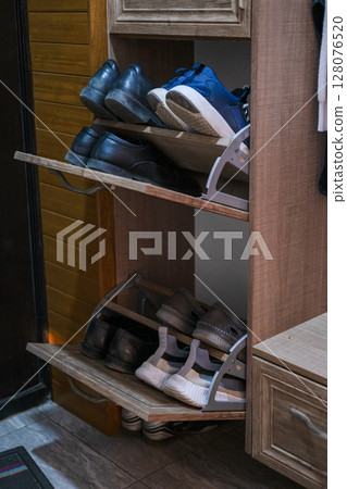 Shoe locker with unloading shelf open Shoe locker with unloading shelf open 128076520