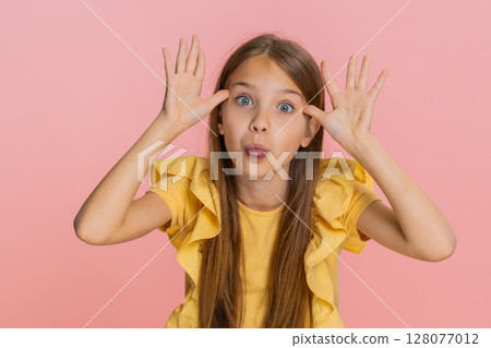 Child girl kid playfully teasing sticking out tongue at camera while making funny silly expressions Child girl kid playfully teasing sticking out tongue at camera while making funny silly expressions 128077012