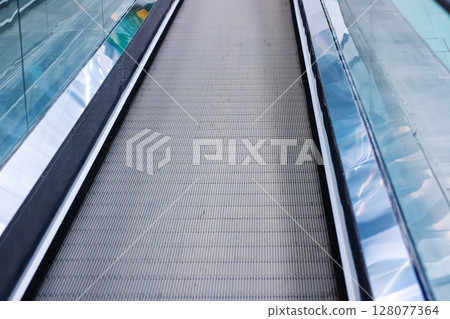 A detailed closeup view of an escalator moving both up and down 128077364