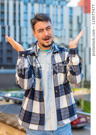 Doubtful sad frustrated mature Caucasian man shrugging shoulders dont know answer on city street Doubtful sad frustrated mature Caucasian man shrugging shoulders dont know answer on city street 128077477