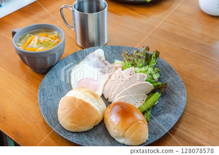 Western-style breakfast plate with chicken ham and bread 128078578