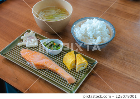 Japanese breakfast of grilled salmon and rolled egg Japanese breakfast of grilled salmon and rolled egg 128079001