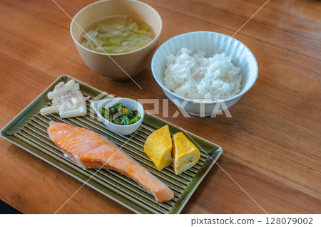 Japanese breakfast of grilled salmon and rolled egg Japanese breakfast of grilled salmon and rolled egg 128079002