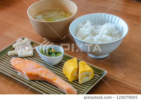 Japanese breakfast of grilled salmon and rolled egg Japanese breakfast of grilled salmon and rolled egg 128079005