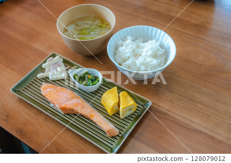 Japanese breakfast of grilled salmon and rolled egg Japanese breakfast of grilled salmon and rolled egg 128079012