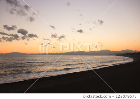 Grey clouds floating in the seaside sunset sky 128079575