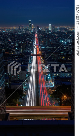 Urban Rooftop Cityscape Night Timelapse with Flowing Traffic and Lights Urban Rooftop Cityscape Night Timelapse with Flowing Traffic and Lights 128079792