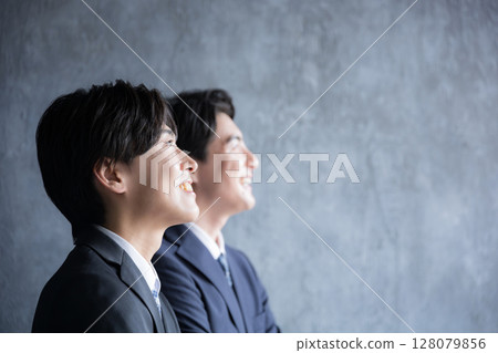 Serious and serious close-up of a business person's profile looking towards the future and goals - Image of a young person or new graduate 128079856