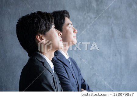 Serious and serious close-up of a business person's profile looking towards the future and goals - Image of a young person or new graduate 128079857