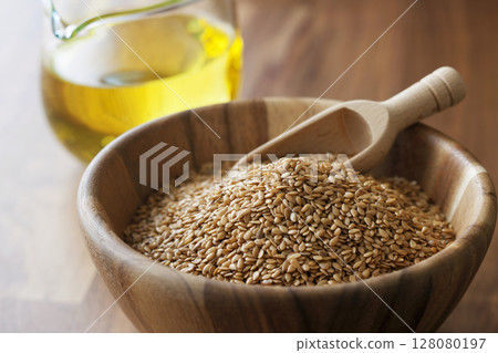 Linseed oil and flax seeds Linseed oil and flax seeds 128080197
