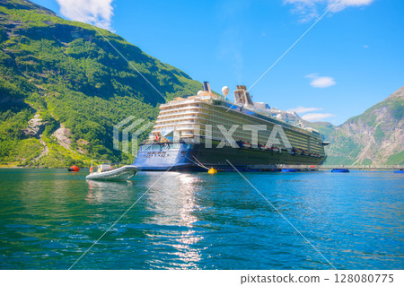 Cruise ship in the fjord. Geiranger Fjord, Norway. Traveling on a Norwegian fjord. Scandinavia. 128080775