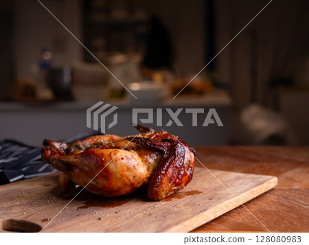 Whole Grilled Chicken on Wooden Table. 128080983