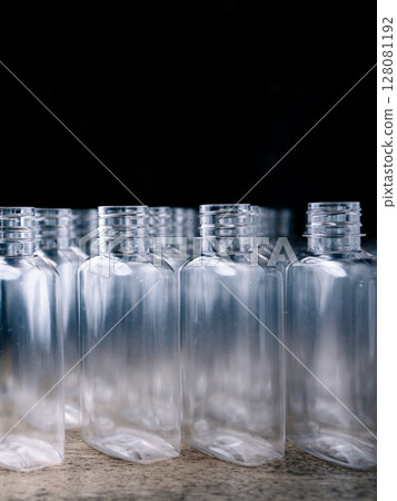 Row of plastic PET Bottles Production Line - Ready for Bottling. Row of plastic PET Bottles Production Line - Ready for Bottling. 128081192