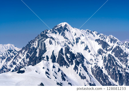 Mount Tsurugi and Tsurugisawa seen from Mount Betsuyama. Climbing Mount Tateyama and Mount Betsuyama in the Northern Alps during the remaining snow season 128081233
