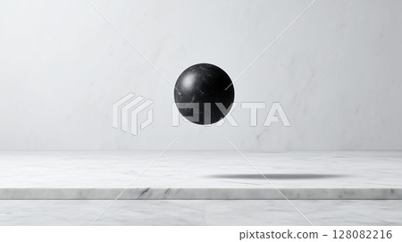 Perfectly spherical matte black stone suspended above smooth marble surface creates striking visual contrast Perfectly spherical matte black stone suspended above smooth marble surface creates striking visual contrast 128082216