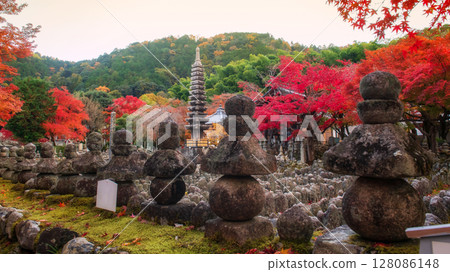 Stone pagoda in graveyard in fall color, Adashino temple, Arashiyama Stone pagoda in graveyard in fall color, Adashino temple, Arashiyama 128086148