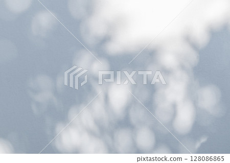 Abstract natural tree leaves shadow on white wall background Abstract natural tree leaves shadow on white wall background 128086865