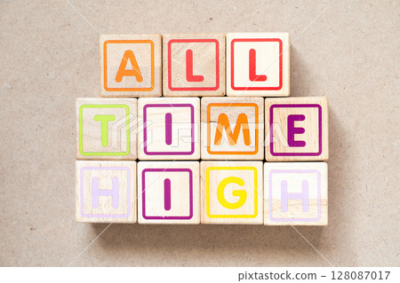 Alphabet letter block in word all time high on wood background 128087017