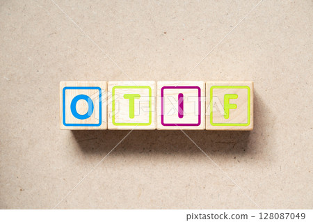 Alphabet letter block in word OTIF (abbreviation of On Time In Full) on wood background Alphabet letter block in word OTIF (abbreviation of On Time In Full) on wood background 128087049