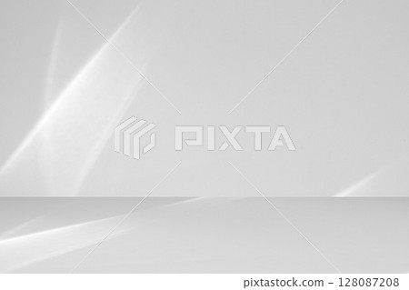 Abstract white studio room with light and shadow from window background for product display presentation 128087208