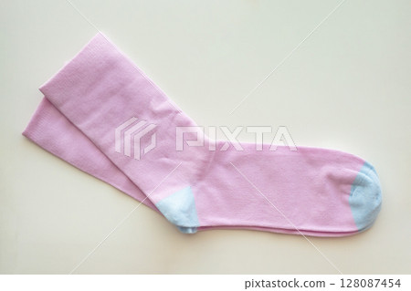Purple cotton sport socks on white background Purple cotton sport socks on white background 128087454