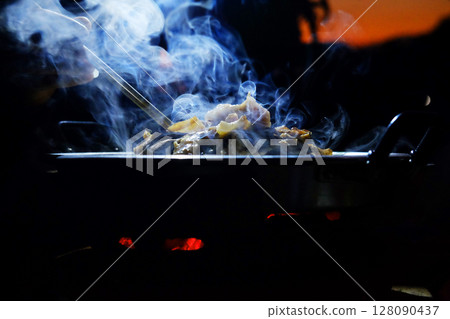 beautiful smoke of Thai BBQ buffet or Thai-style Barbecue in dark night beautiful smoke of Thai BBQ buffet or Thai-style Barbecue in dark night 128090437