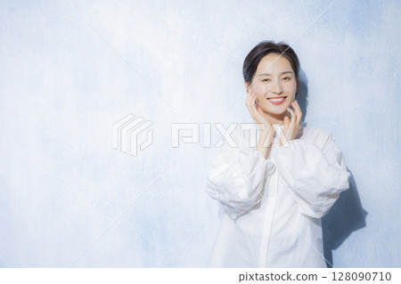 Woman in white blouse Woman in white blouse 128090710