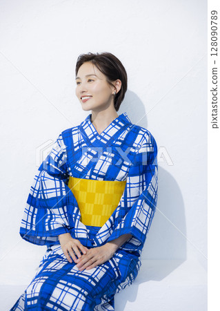 A woman in a yukata A woman in a yukata 128090789