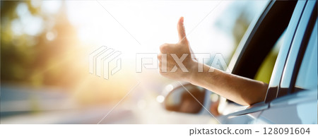 A man's hand sticking out of a car window and showing a thumbs-up signifies positivity and a great vibe A man's hand sticking out of a car window and showing a thumbs-up signifies positivity and a great vibe 128091604