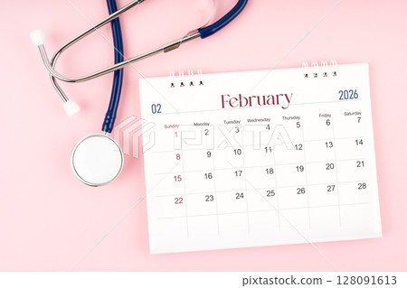 Blank February 2026 desk calendar and stethoscope, Medical appointment schedule to check up. Blank February 2026 desk calendar and stethoscope, Medical appointment schedule to check up. 128091613
