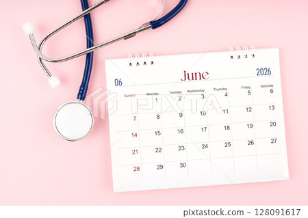 Blank June 2026 desk calendar and stethoscope, Medical appointment schedule to check up. 128091617