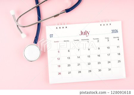 Blank July 2026 desk calendar and stethoscope, Medical appointment schedule to check up. 128091618
