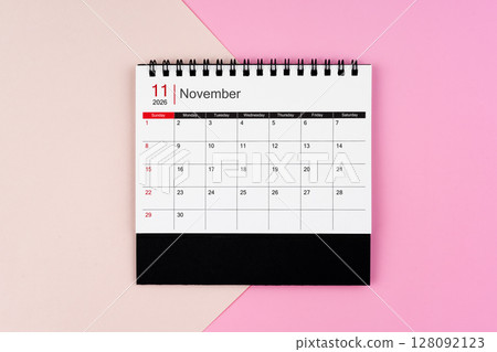 November 2026 desk calendar on pink background, Position is center of frame. 128092123