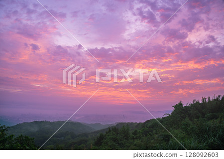 Dramatic Sunset Over Shulin Mountains and Distant Cityscape Taiwan. Dramatic Sunset Over Shulin Mountains and Distant Cityscape Taiwan. 128092603