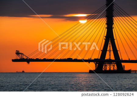 Fiery Sunset with Danshui New Taipei Taiwan Cable Bridge Silhouette. Fiery Sunset with Danshui New Taipei Taiwan Cable Bridge Silhouette. 128092624