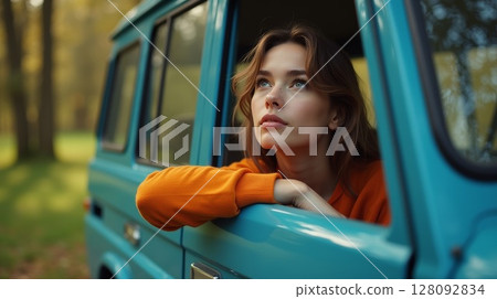 Woman Contemplating Nature from Car Window 128092834