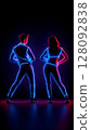Dancers performing with neon lights on their bodies 128092838