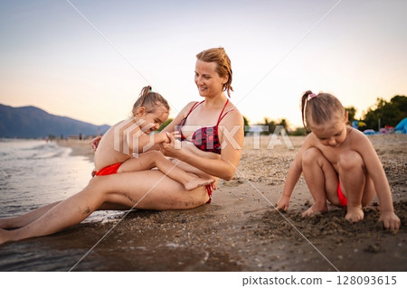 Enjoying the sunset on a Greece summer beach day 128093615