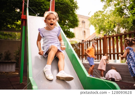 Joyful summer playtime at a Greek playground 128093628