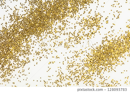 Festive or glamorous background. Gold sparkles scattered on a white background. 128093783