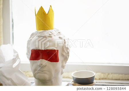 Caesar plaster head with red stripe on the eyes. Caesar plaster head with red stripe on the eyes. 128093844