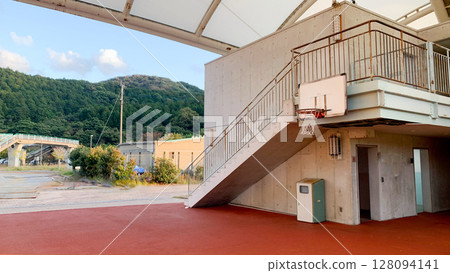 Outdoor basketball court in the evening Outdoor basketball court in the evening 128094141
