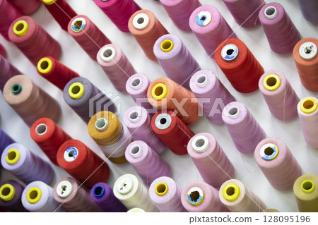 Spools of thread in various colors for the sewing studio. Spools of thread in various colors for the sewing studio. 128095196