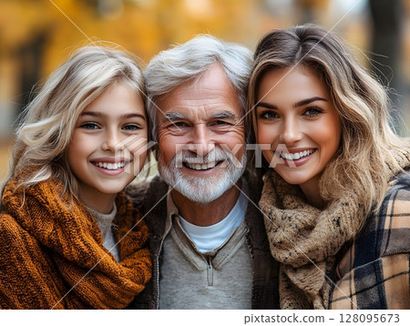family of different generations smiling together in a park 128095673