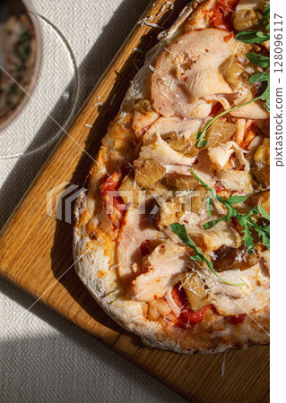 Pinsa with turkey porcini mushrooms and cheese 128096117