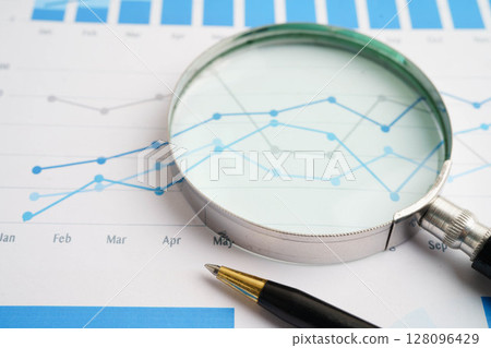 Magnifying glass on charts graphs paper. Financial development, Banking Account, Statistics, Investment Analytic research data economy. Magnifying glass on charts graphs paper. Financial development, Banking Account, Statistics, Investment Analytic research data economy. 128096429