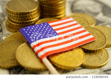 USA American flag on coins background, finance and accounting, banking concept. 128096444