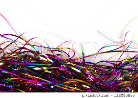 Background multicolored shiny tinsel on a white background. 128096656