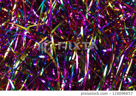 Background multicolored shiny tinsel. 128096657