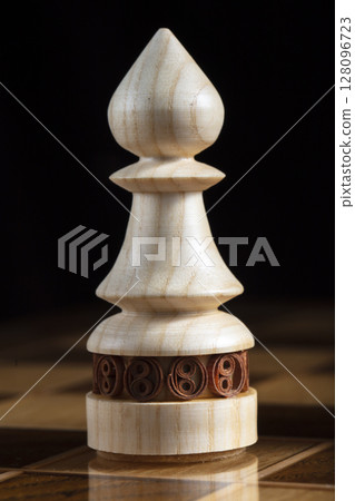 Chess wooden elephant. A puzzle game with tricky combinations that requires planning and thinking. 128096723